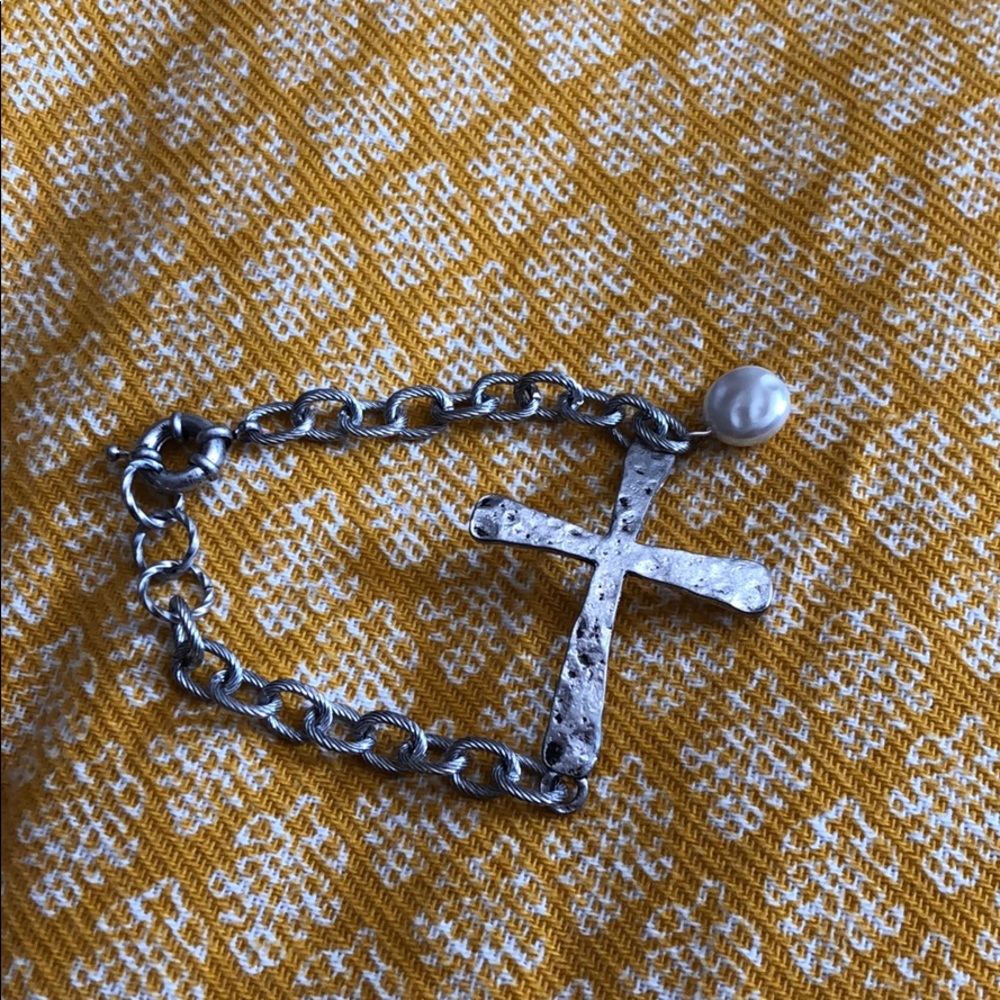Cross bracelet and neckless.